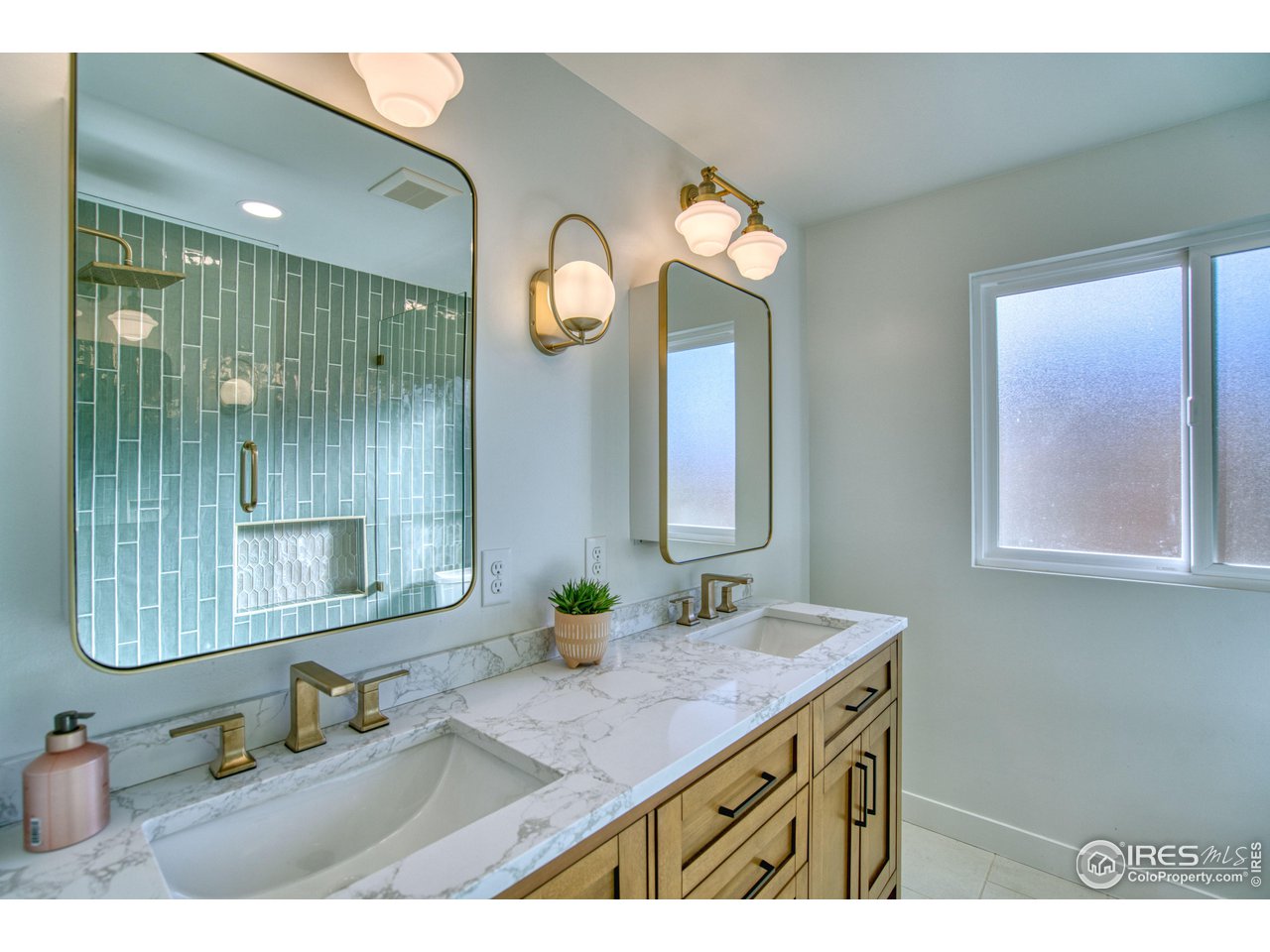 2154 Stuart Street Longmont, CO 80501 - Photo 5 of 27 a bathroom with a sink and a mirror