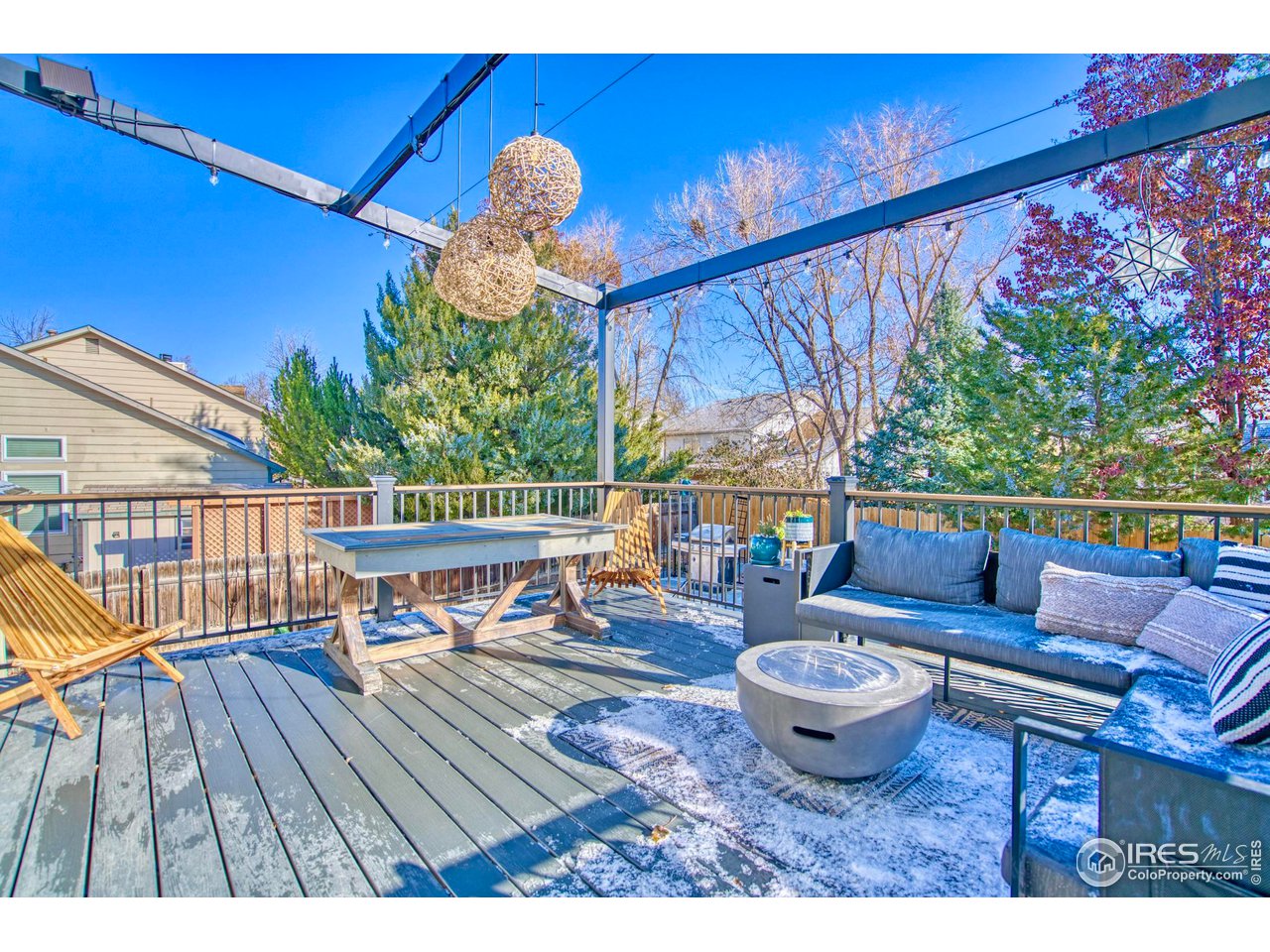 2154 Stuart Street Longmont, CO 80501 - Photo 9 of 27 a roof deck with table and chairs potted plants with wooden floor