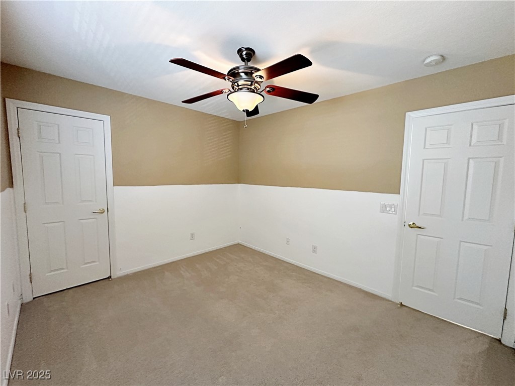 9620 Sharp Horn Court Las Vegas, NV 89149 - Photo 23 of 40 Empty room featuring light carpet and ceiling fan