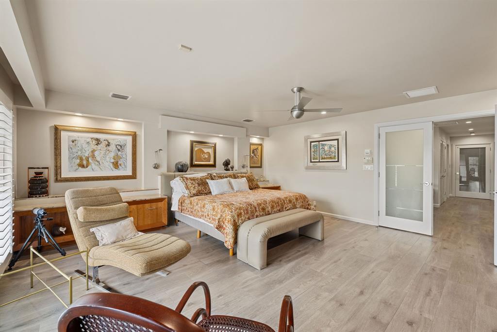 3150 North 35th Street Hollywood, FL 33021 - Photo 33 of 48 a spacious bedroom with a bed and wooden floor