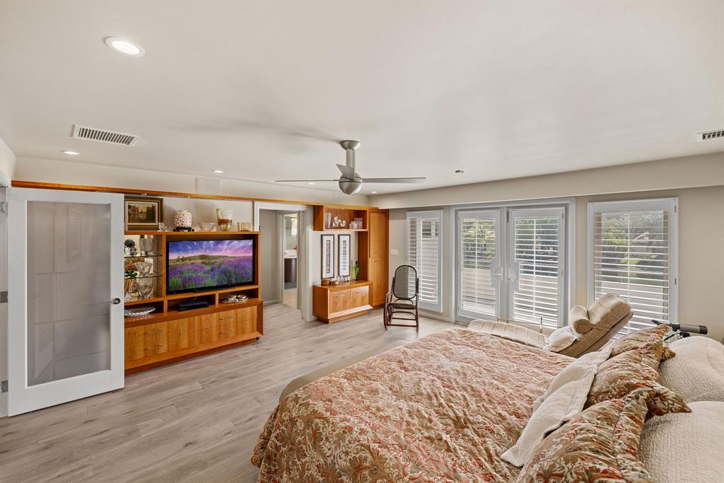 3150 North 35th Street Hollywood, FL 33021 - Photo 34 of 48 a bedroom with a bed and a flat screen tv