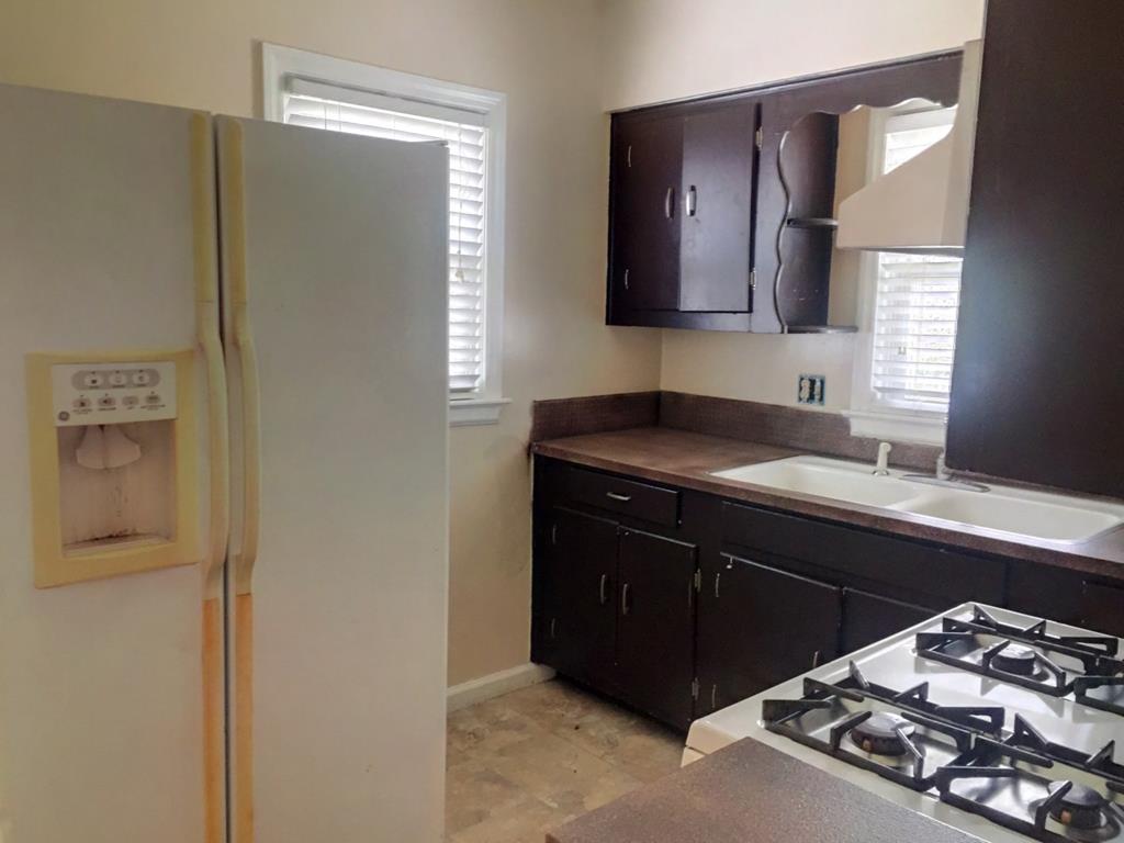 2651 Reese Road Columbus, GA 31907 - Photo 5 of 21 a kitchen with a sink and a refrigerator