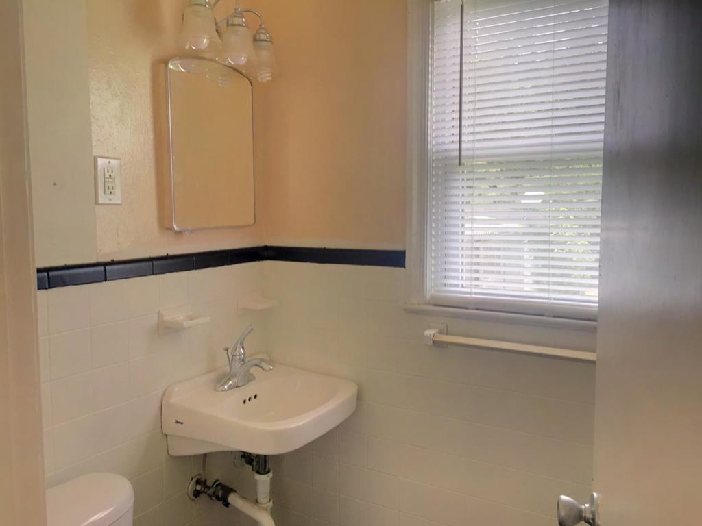 2651 Reese Road Columbus, GA 31907 - Photo 9 of 21 a bathroom with a sink a mirror and a window