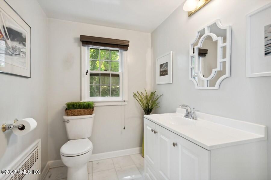 21 Stanwich Lane Greenwich, CT 06830 - Photo 18 of 45 a bathroom with a sink toilet and a mirror