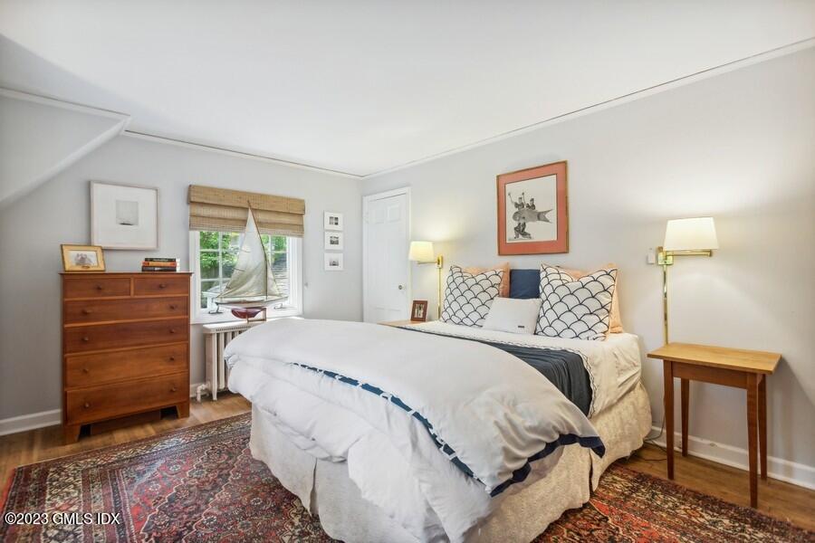 21 Stanwich Lane Greenwich, CT 06830 - Photo 19 of 45 a bedroom with a bed and dresser