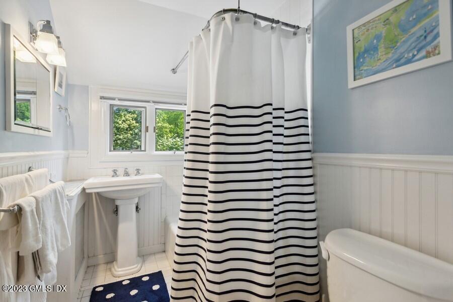 21 Stanwich Lane Greenwich, CT 06830 - Photo 21 of 45 a bathroom with a sink toilet and window