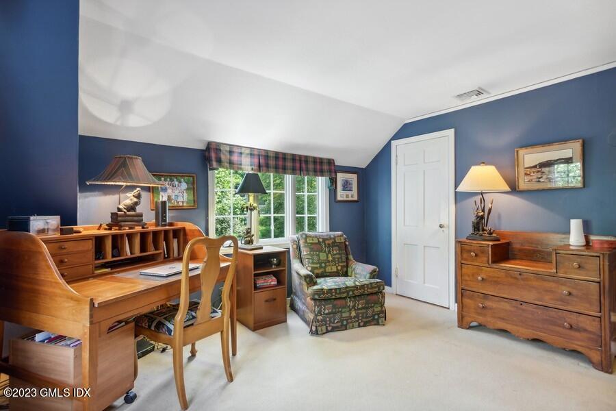 21 Stanwich Lane Greenwich, CT 06830 - Photo 22 of 45 a room with furniture and a flat screen tv