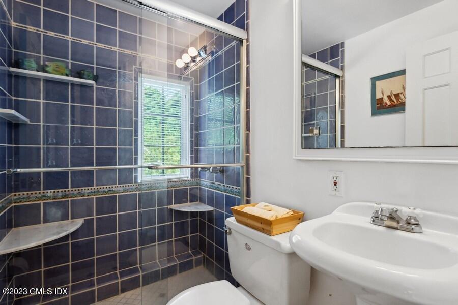 21 Stanwich Lane Greenwich, CT 06830 - Photo 23 of 45 a bathroom with a sink toilet and shower