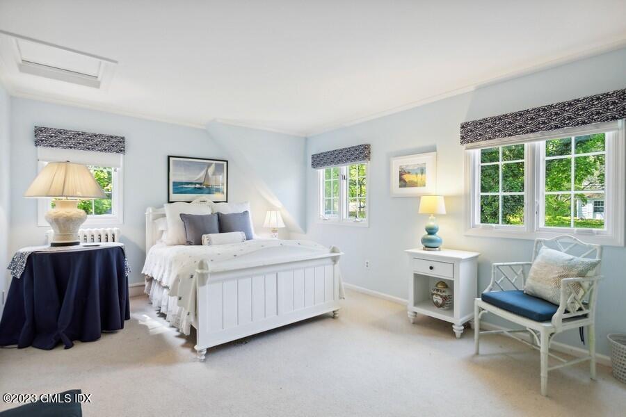 21 Stanwich Lane Greenwich, CT 06830 - Photo 26 of 45 a bedroom with a bed and a dresser next to a window