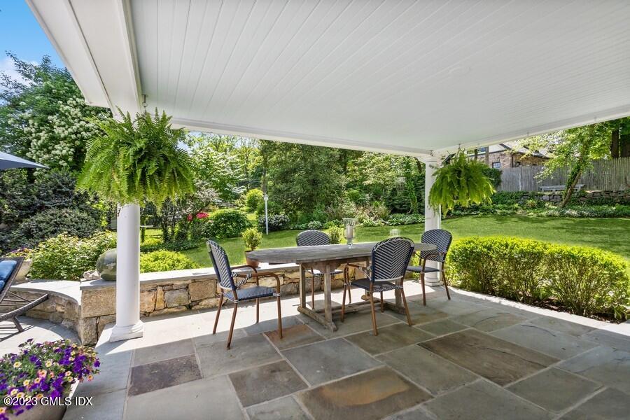 21 Stanwich Lane Greenwich, CT 06830 - Photo 31 of 45 a view of a patio with a garden