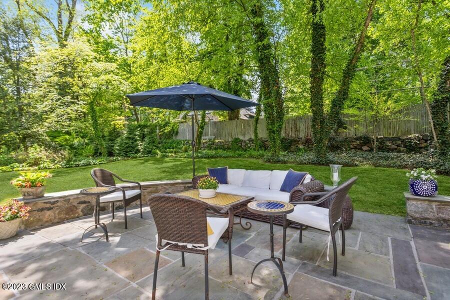 21 Stanwich Lane Greenwich, CT 06830 - Photo 34 of 45 a view of chair and table with umbrella in the garden