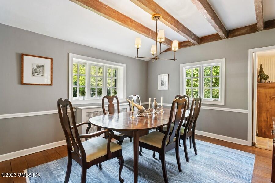 21 Stanwich Lane Greenwich, CT 06830 - Photo 8 of 45 a view of a dining room with furniture a chandelier and wooden floor