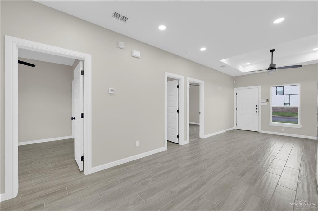905 Crestview Street, Unit 2 Weslaco, TX 78596 - Photo 7 of 12 a view of a livingroom with wooden floor