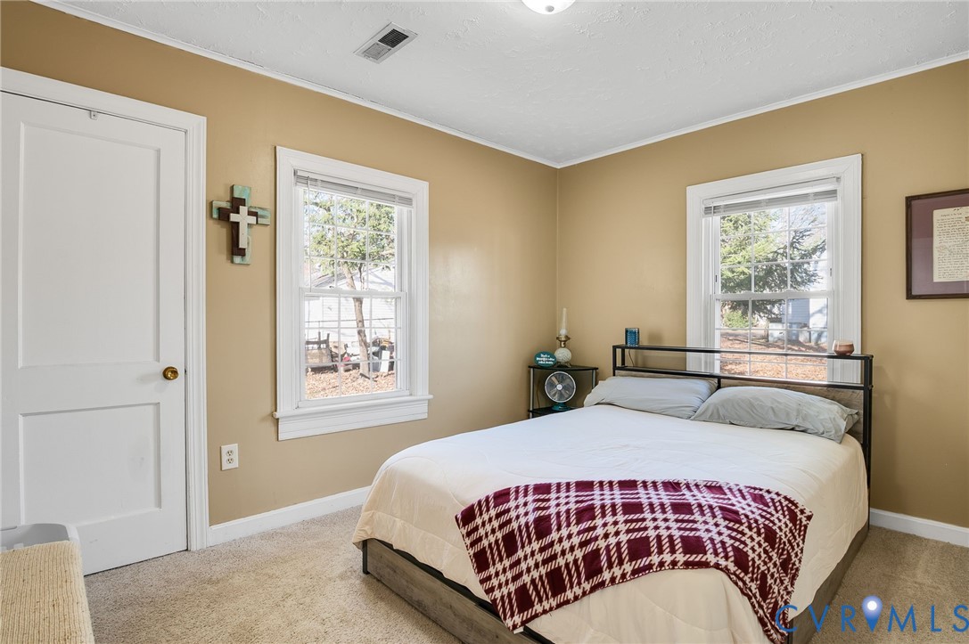 3203 Courthouse Road Hopewell, VA 23860 - Photo 12 of 23 a bedroom with a large bed and a window