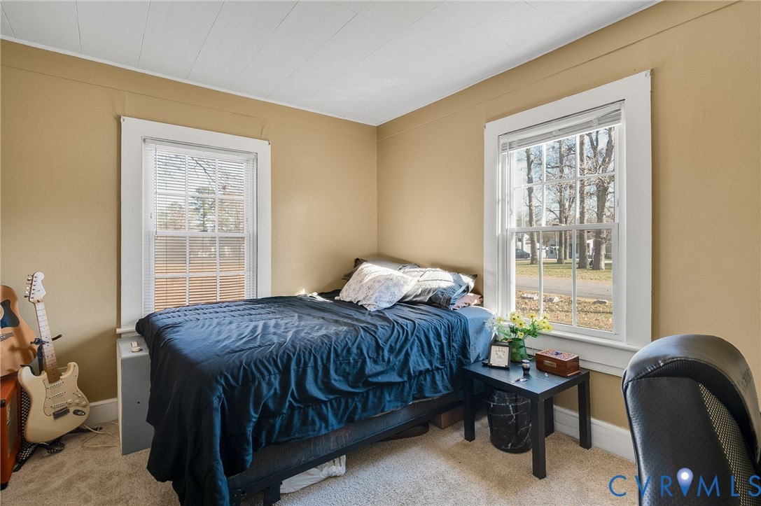 3203 Courthouse Road Hopewell, VA 23860 - Photo 15 of 23 a bedroom with a bed chair and window