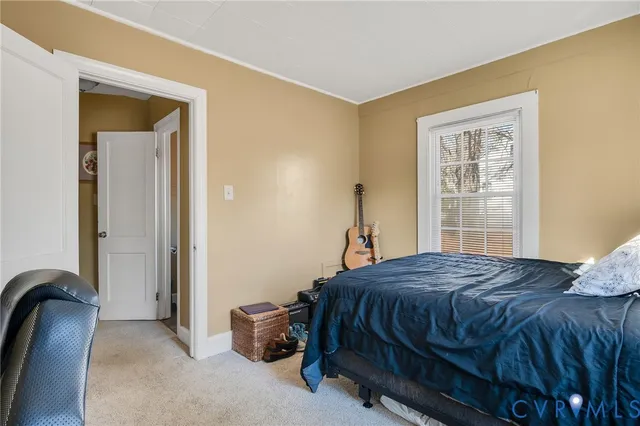 a bedroom with a bed and with a dresser