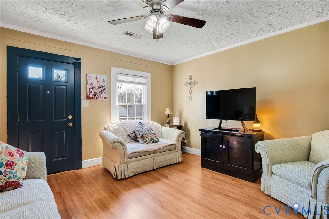 3203 Courthouse Road Hopewell, VA 23860 - Photo 6 of 23 a living room with furniture and a flat screen tv