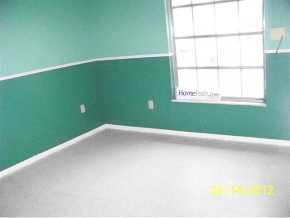 2959 Northeast Gemini Palm Bay, FL 32905 - Photo 2 of 12 a view of an empty room with a window