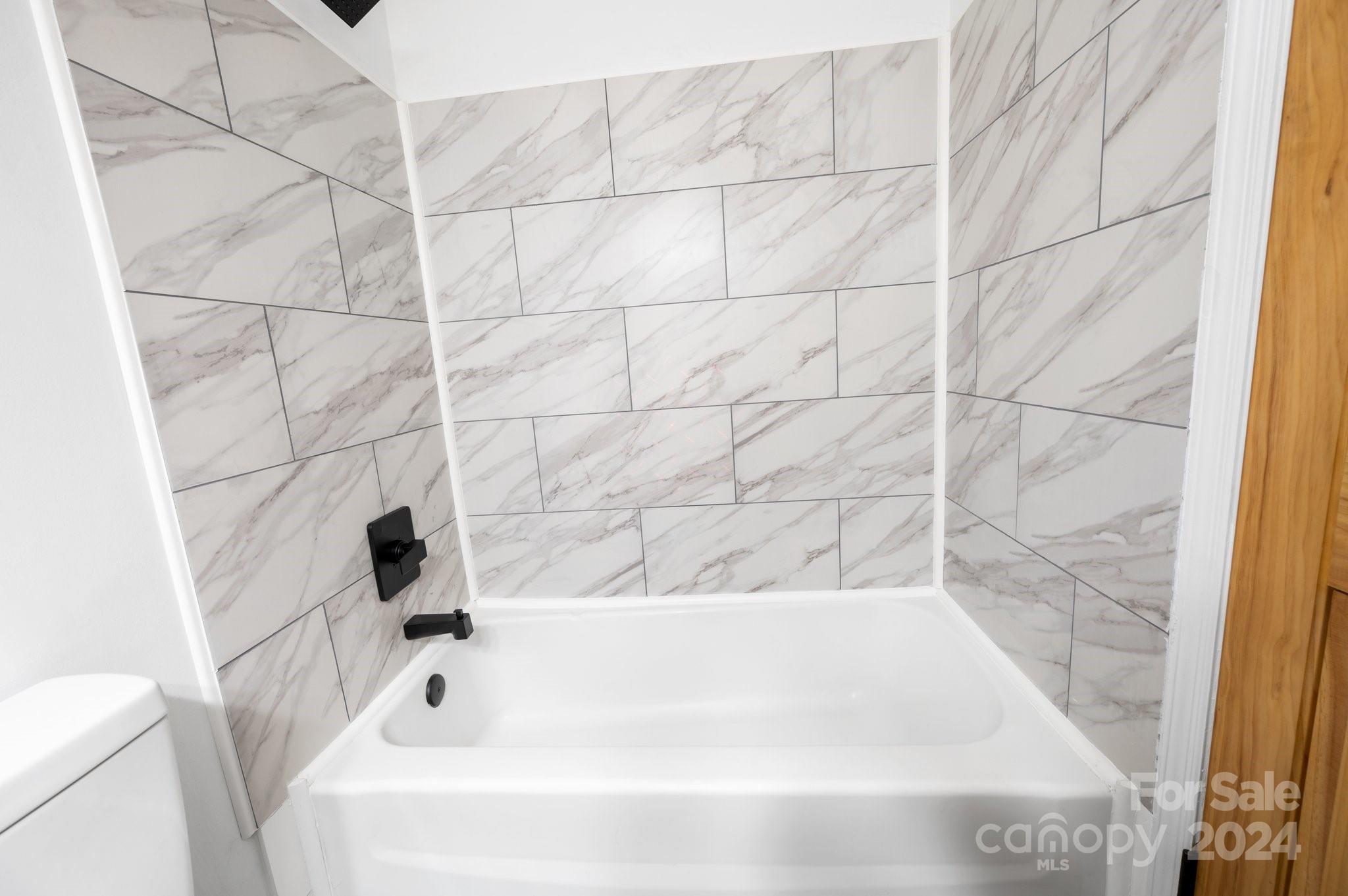 12 South Ridge Place Arden, NC 28704 - Photo 14 of 41 a bathroom with a bathtub