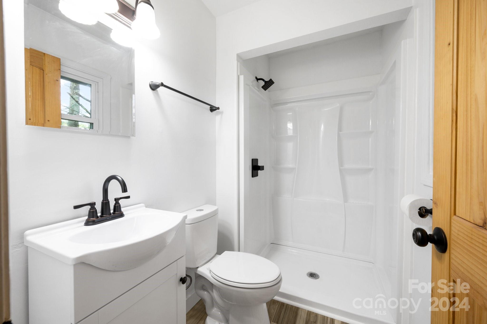 12 South Ridge Place Arden, NC 28704 - Photo 17 of 41 a bathroom with a sink toilet and shower