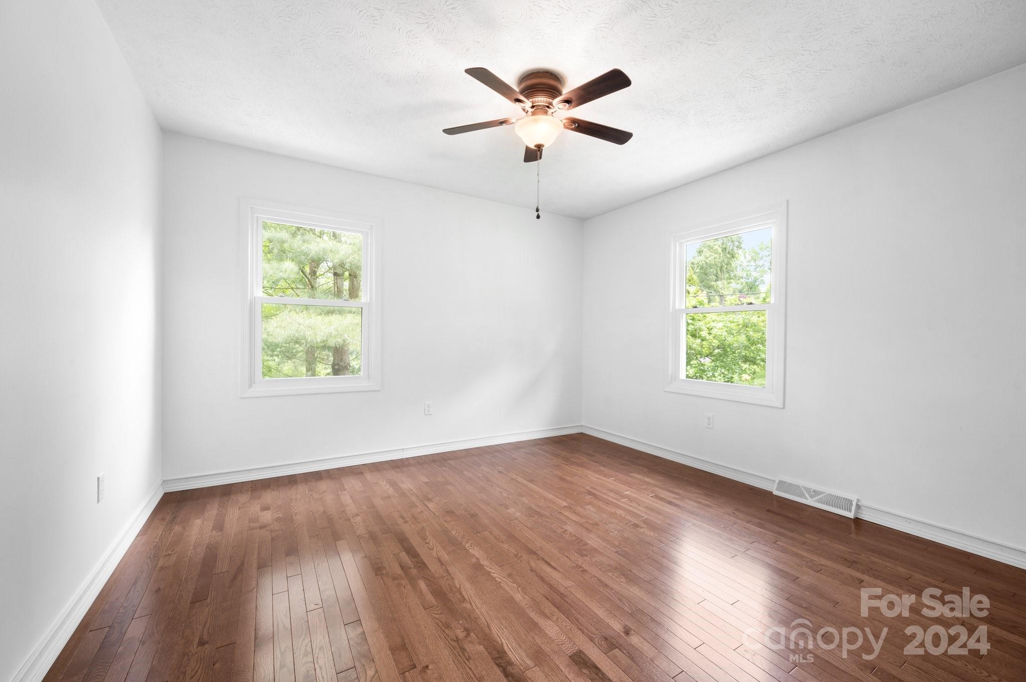 12 South Ridge Place Arden, NC 28704 - Photo 21 of 41 an empty room with window and ceiling fan