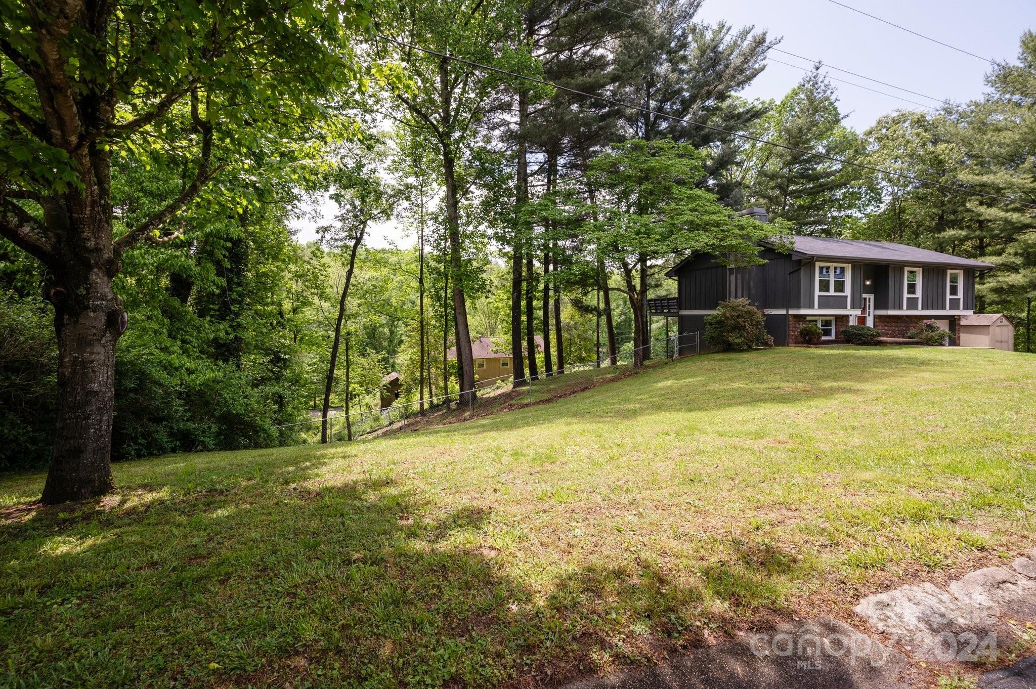 12 South Ridge Place Arden, NC 28704 - Photo 29 of 41 a view of a house with a yard and sitting area