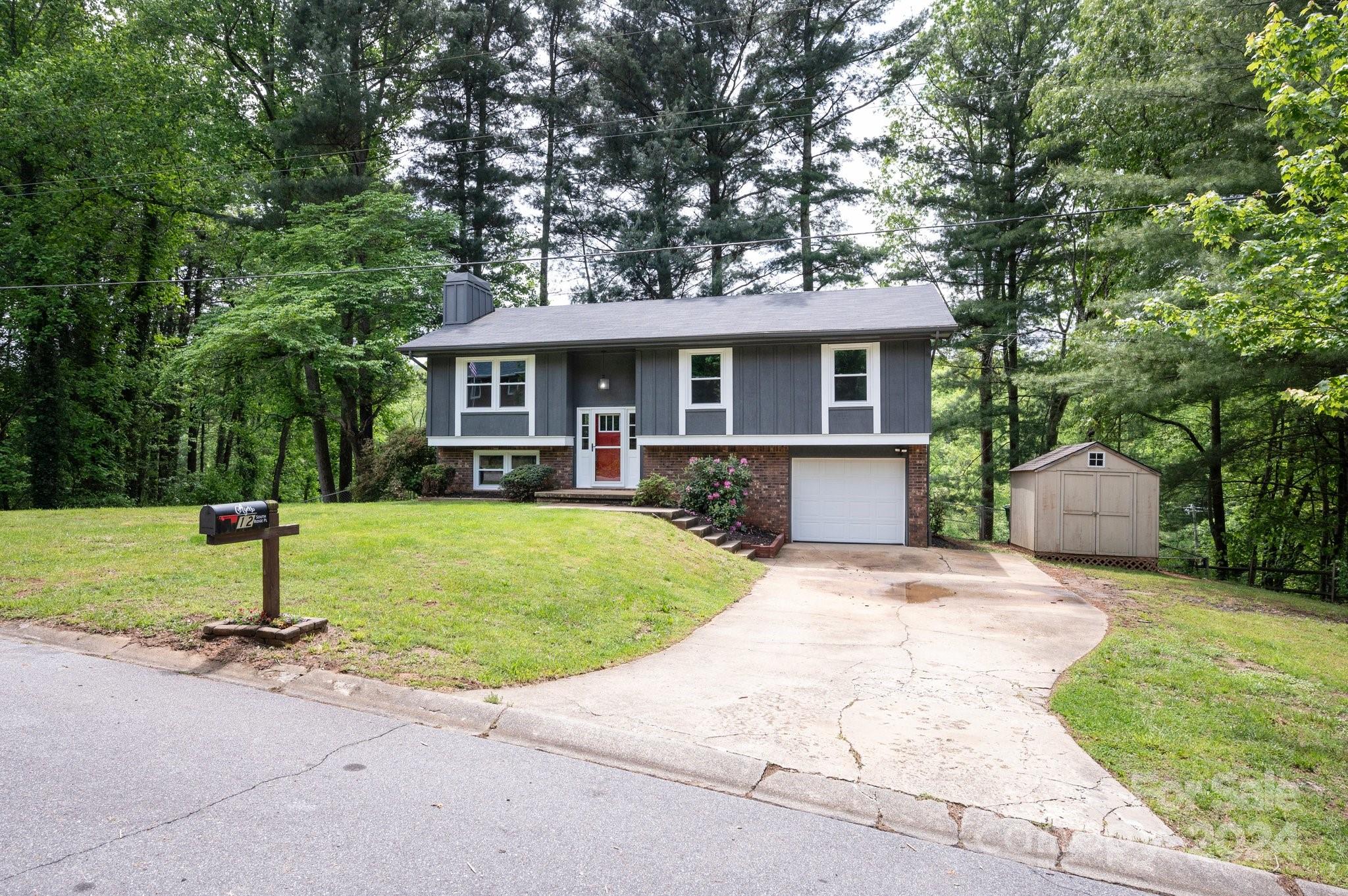 12 South Ridge Place Arden, NC 28704 - Photo 31 of 41 front view of a house with a yard