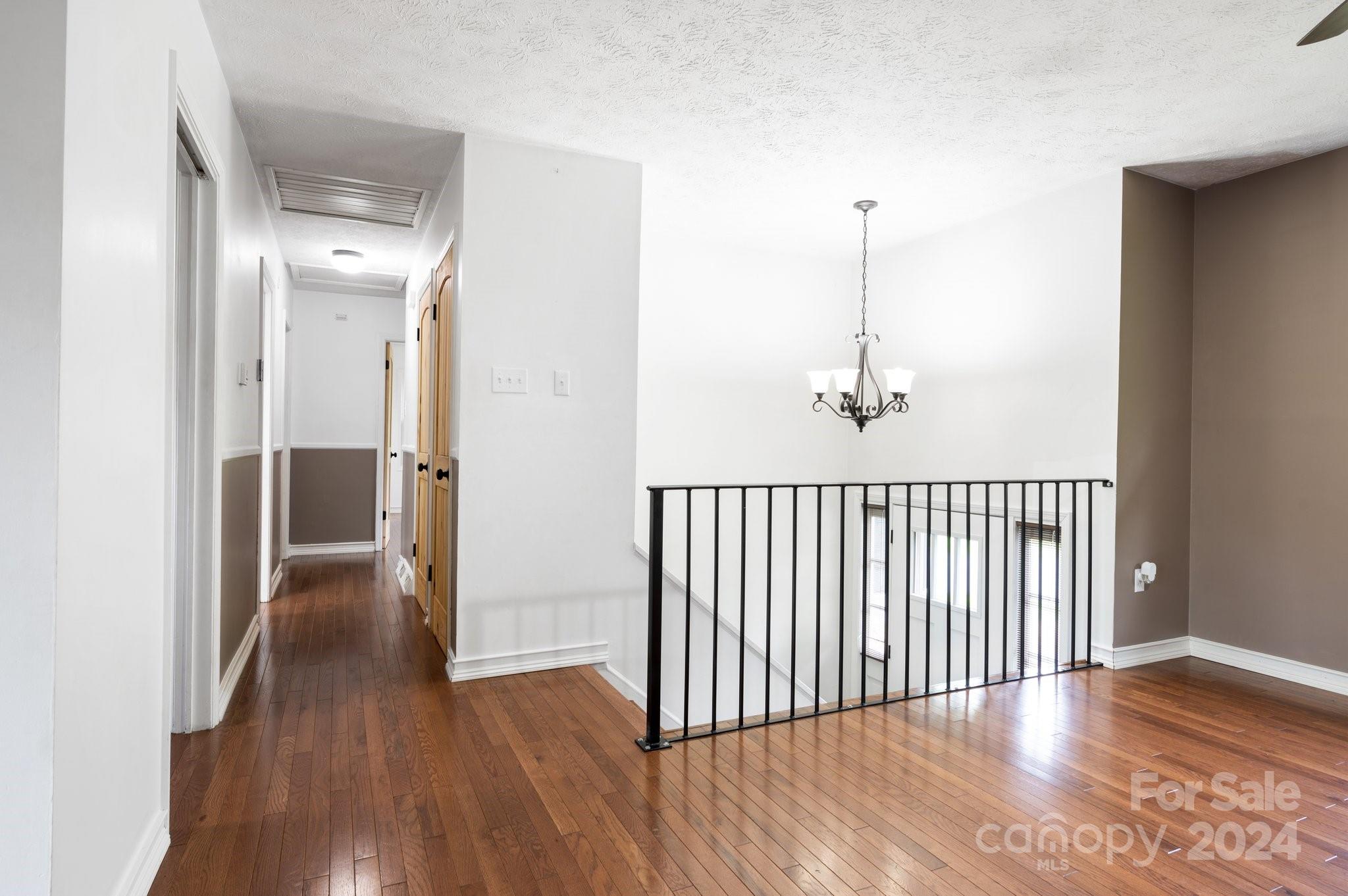 12 South Ridge Place Arden, NC 28704 - Photo 7 of 41 a view of a hallway with wooden floor