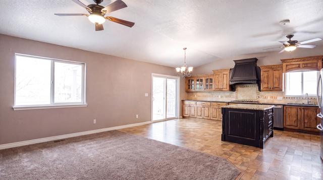 955 West 2390th South Perry, UT 84302 - Photo 14 of 51 Great Room shown vacant in order to accent the neutral tones of the home.