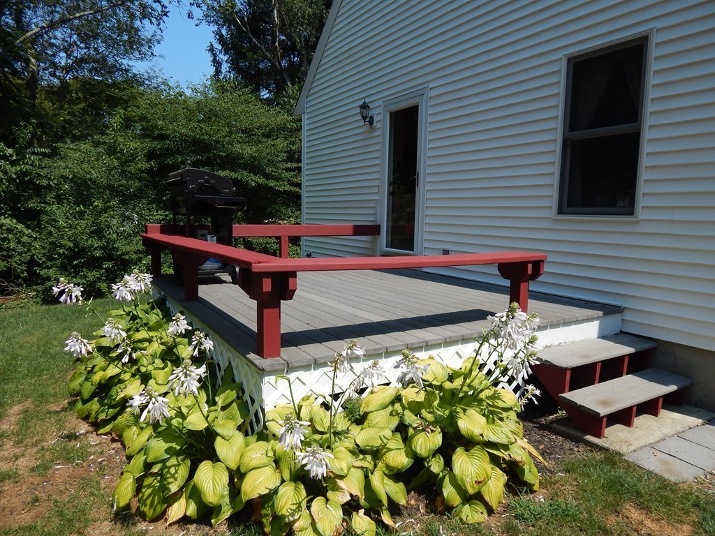 25 Forge Road Freetown, MA 02702 - Photo 20 of 21 a bench sitting in front of a white house