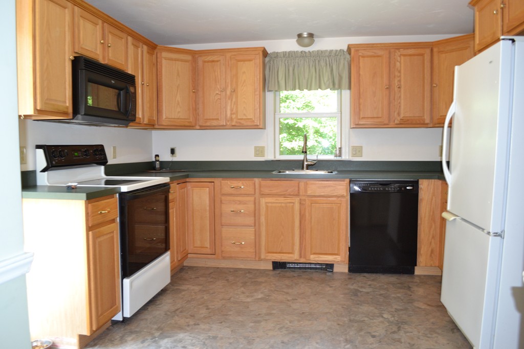 25 Forge Road Freetown, MA 02702 - Photo 4 of 21 a kitchen with stainless steel appliances granite countertop a stove a refrigerator and a microwave