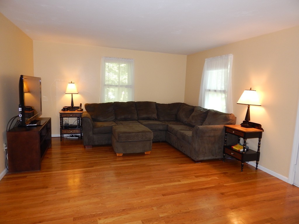 25 Forge Road Freetown, MA 02702 - Photo 6 of 21 a living room with furniture a large window and a flat screen tv