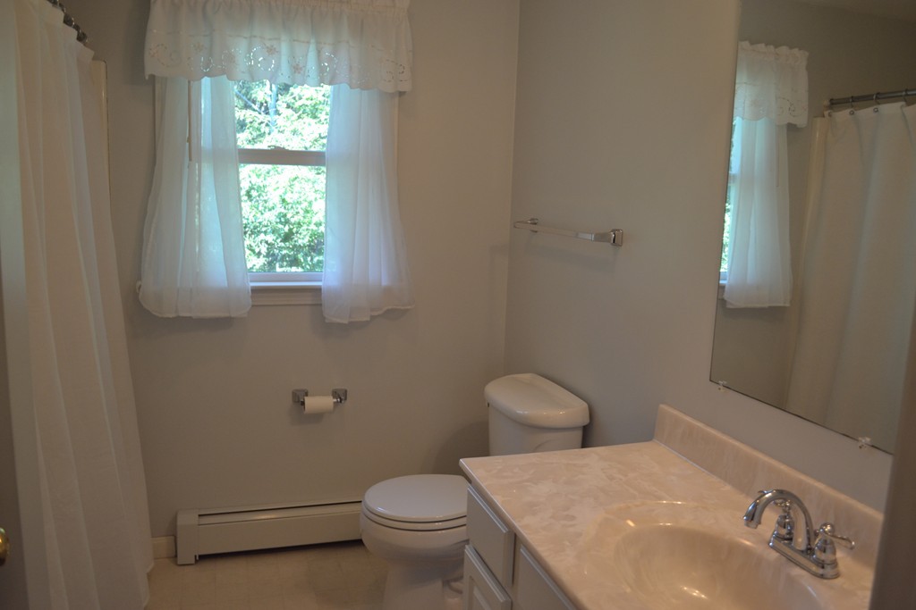 25 Forge Road Freetown, MA 02702 - Photo 8 of 21 a bathroom with a sink a toilet and a window