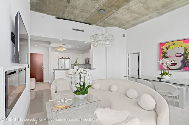 a living room with furniture and a table