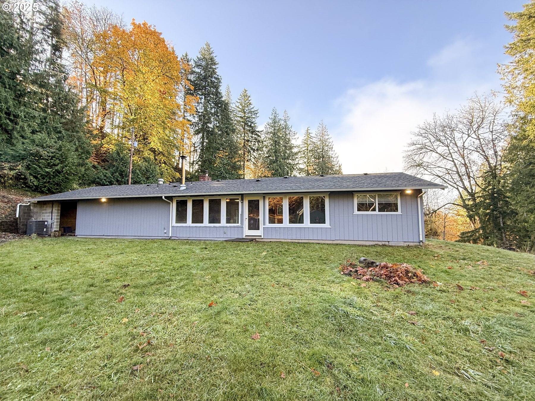 26609 South Elwood Road Colton, OR 97017 - Photo 16 of 38 a house is sitting in middle of the green field