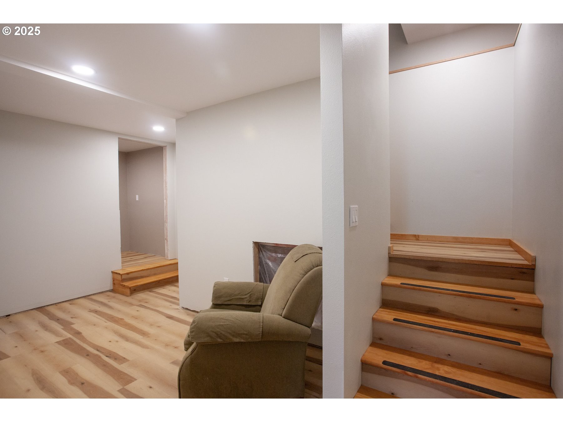 26609 South Elwood Road Colton, OR 97017 - Photo 36 of 38 a view of room with stairs and wooden floor