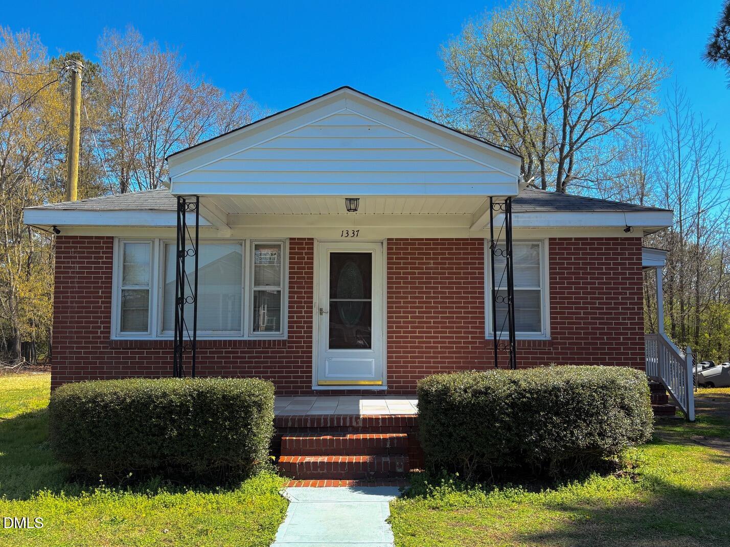 1337 Maple Street Rocky Mount, NC 27803 - Photo 1 of 15 a front view of a house with a yard