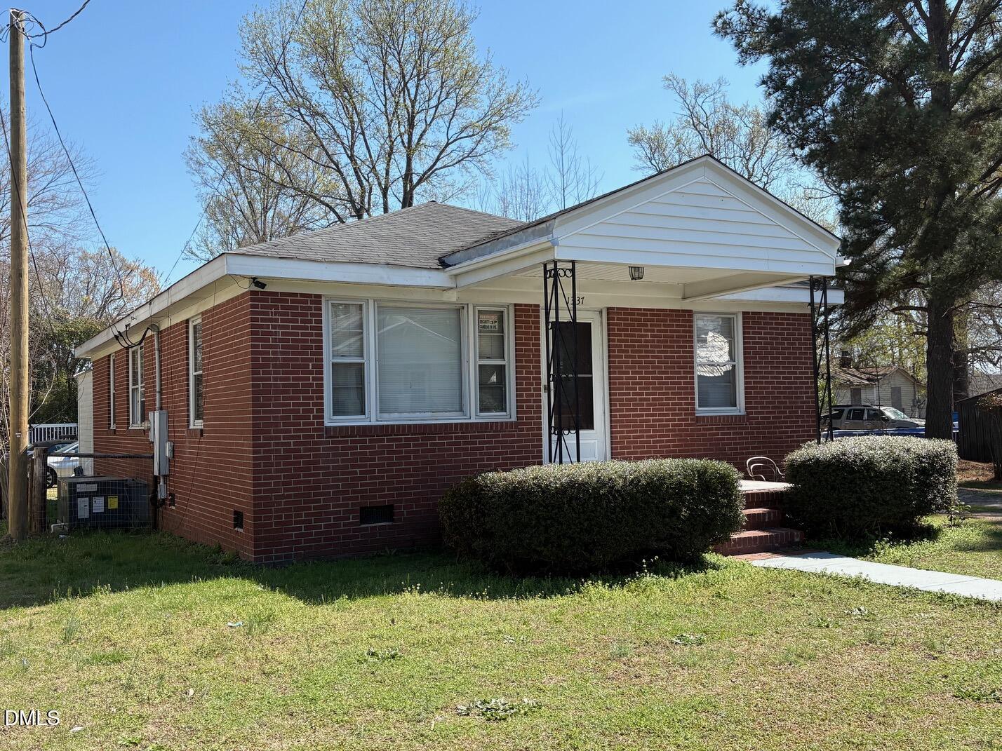 1337 Maple Street Rocky Mount, NC 27803 - Photo 14 of 15 a front view of a house with a garden