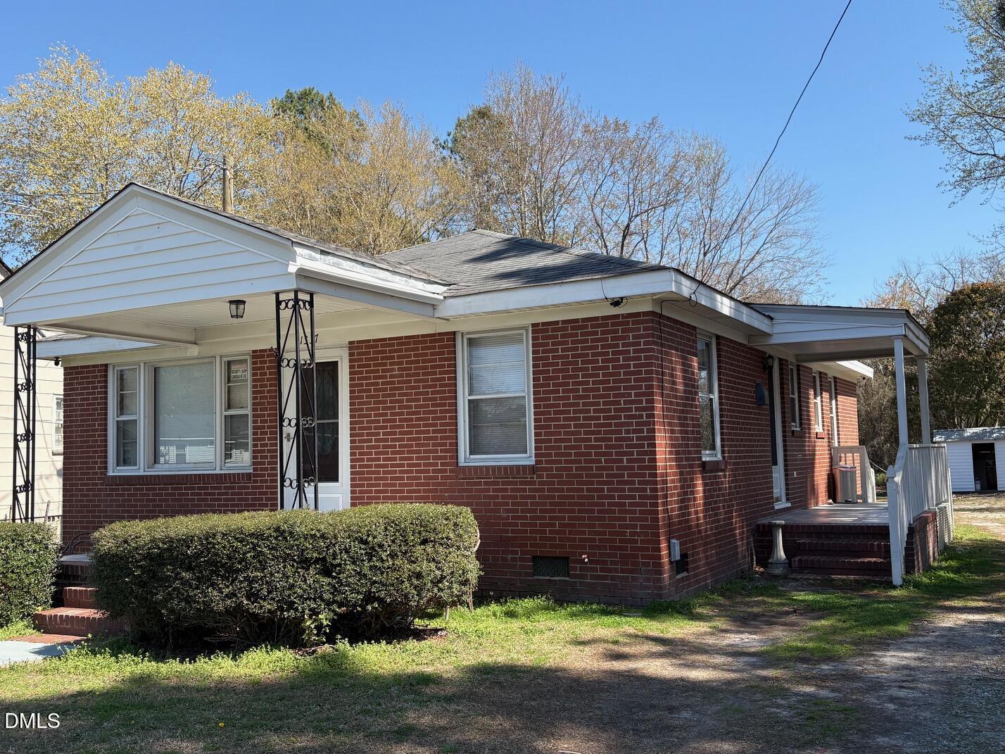 1337 Maple Street Rocky Mount, NC 27803 - Photo 15 of 15 a front view of a house with a garden