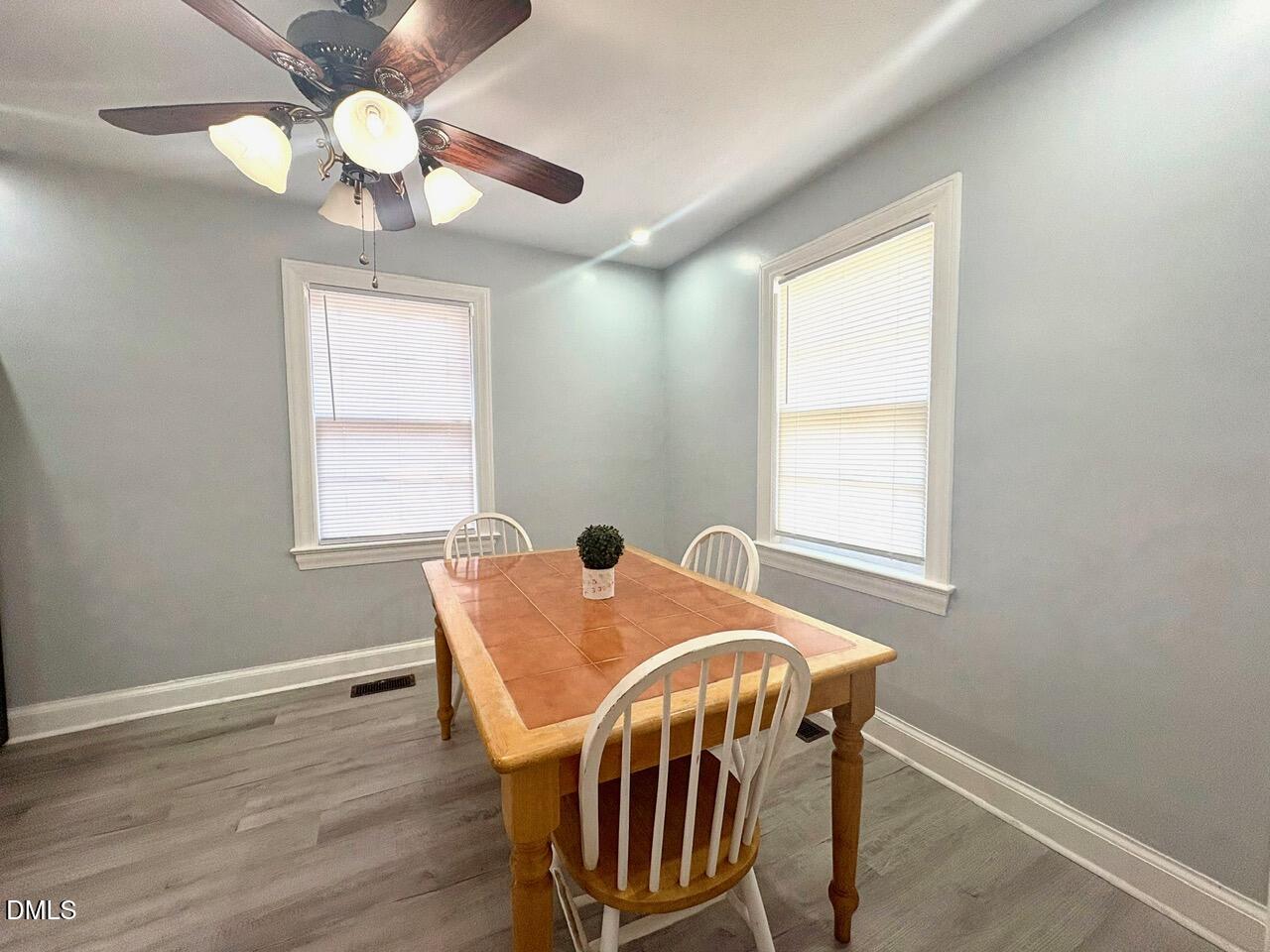 1337 Maple Street Rocky Mount, NC 27803 - Photo 5 of 15 a view of a dining room with furniture window and wooden floor