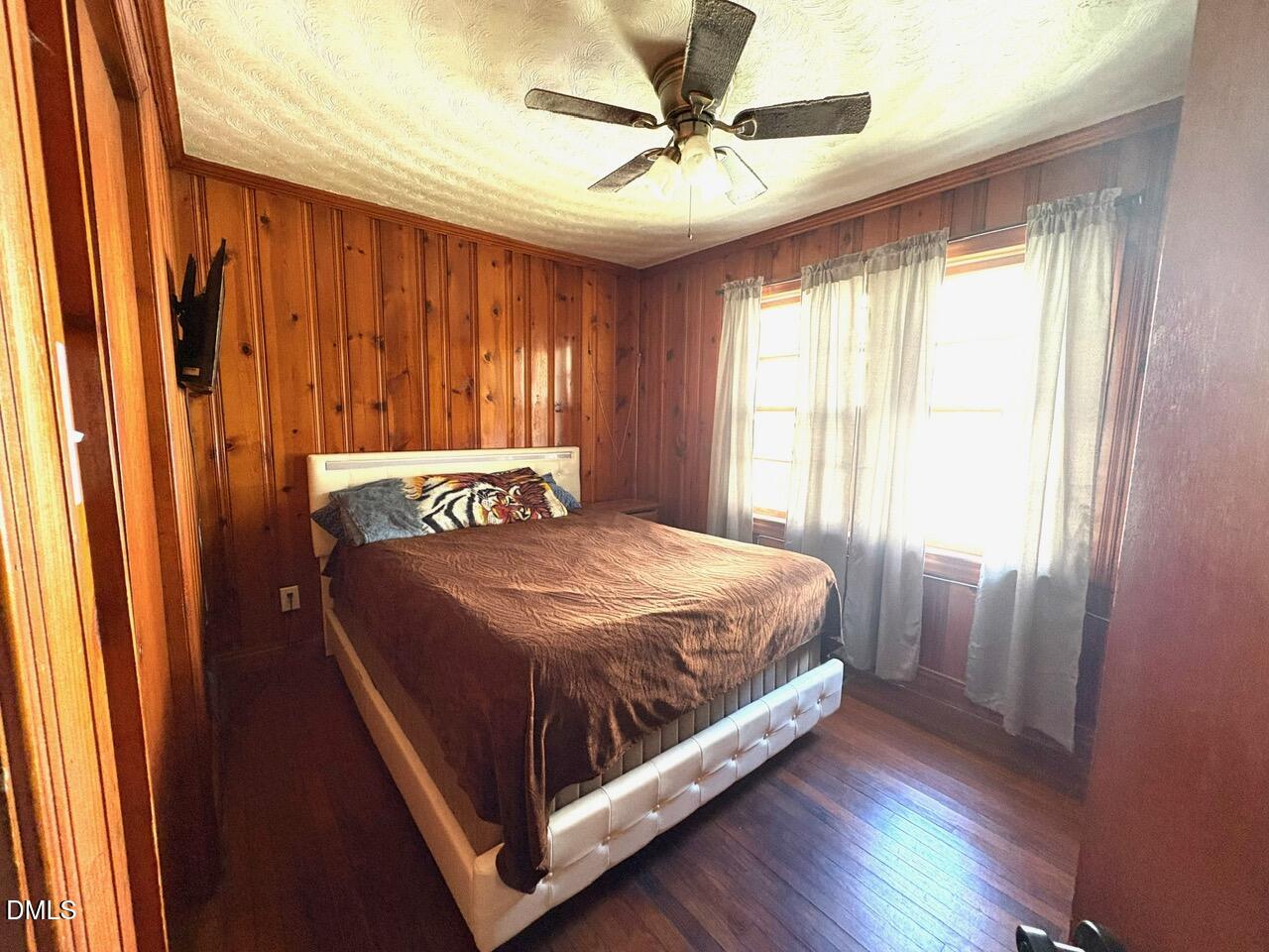 1337 Maple Street Rocky Mount, NC 27803 - Photo 9 of 15 a bedroom with a bed and a window