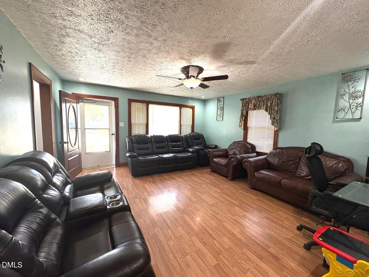 1337 Maple Street Rocky Mount, NC 27803 - Photo 10 of 15 a living room with furniture fireplace and a large window