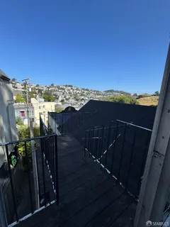 a view of a balcony with an ocean view