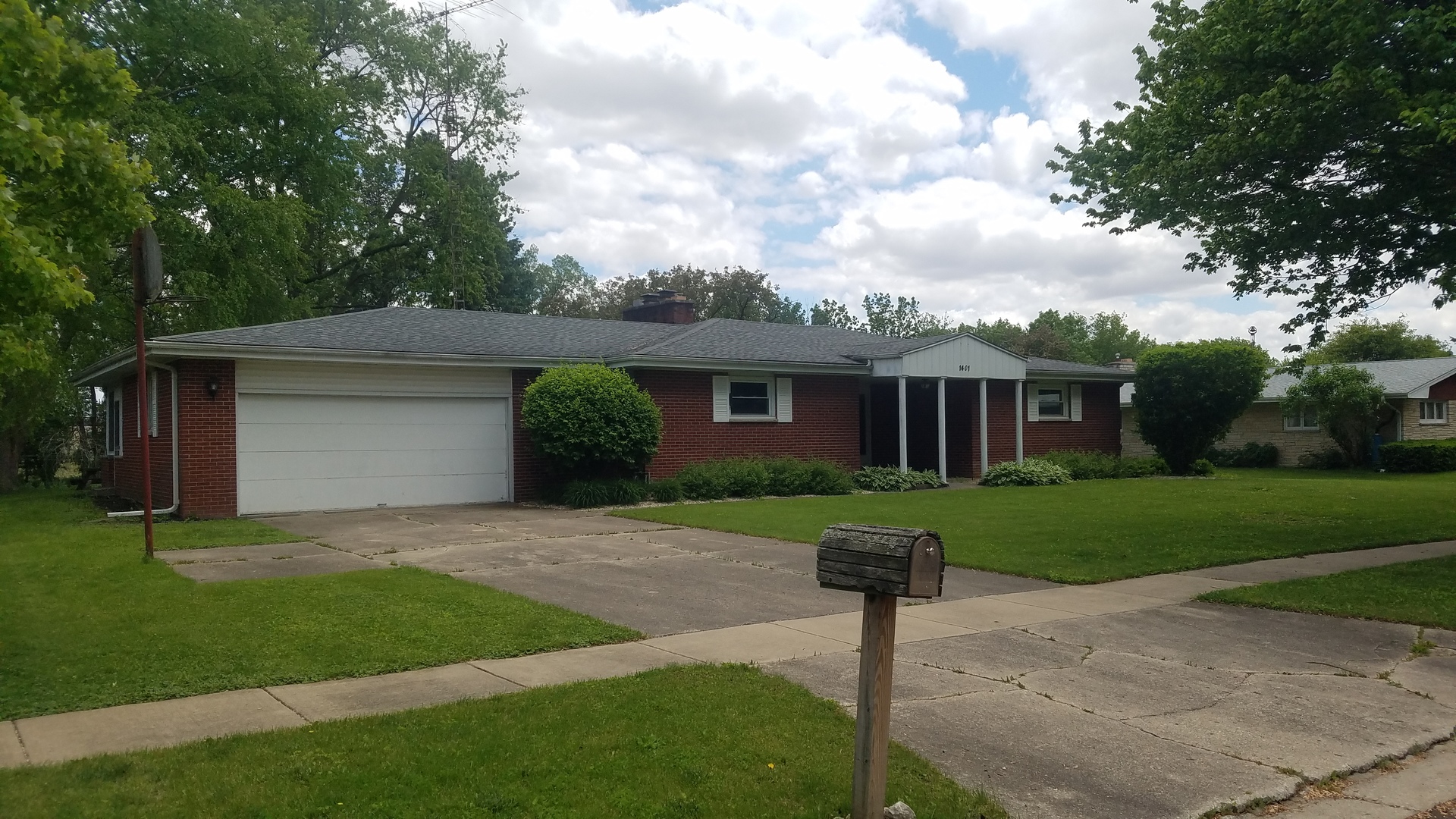 1401 Brookside Drive Rochelle, IL 61068 - Photo 1 of 20 a front view of a house with a yard and a tree