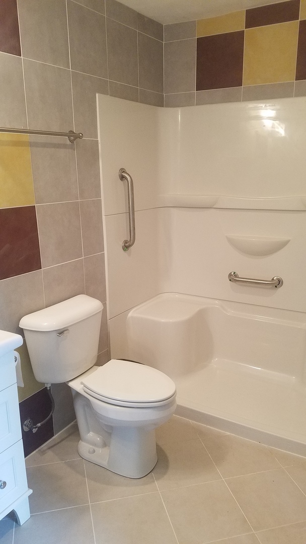 1401 Brookside Drive Rochelle, IL 61068 - Photo 15 of 20 a white toilet sitting next to a bath tub