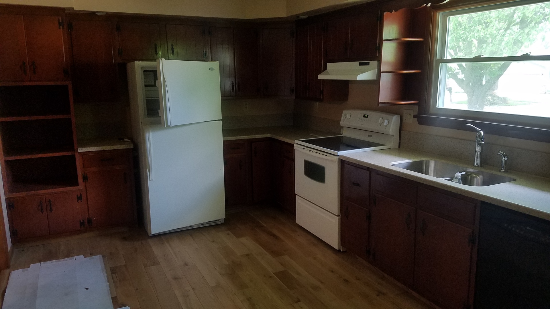 1401 Brookside Drive Rochelle, IL 61068 - Photo 5 of 20 a kitchen with a refrigerator sink and wooden floor