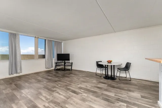 a view of a livingroom with furniture and wooden floor
