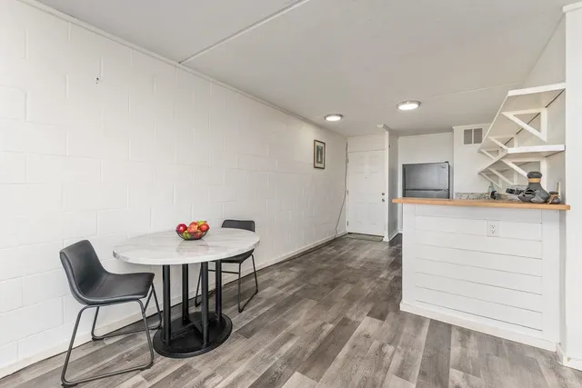 a room with a table and chairs