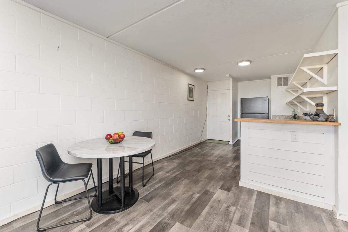 111 Kahului Beach Road, Unit A104 Kahului, HI 96732 - Photo 19 of 38 a room with a table and chairs