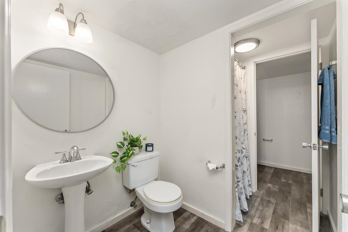 111 Kahului Beach Road, Unit A104 Kahului, HI 96732 - Photo 20 of 38 a bathroom with a sink toilet and a mirror